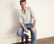 Man sitting in jeans